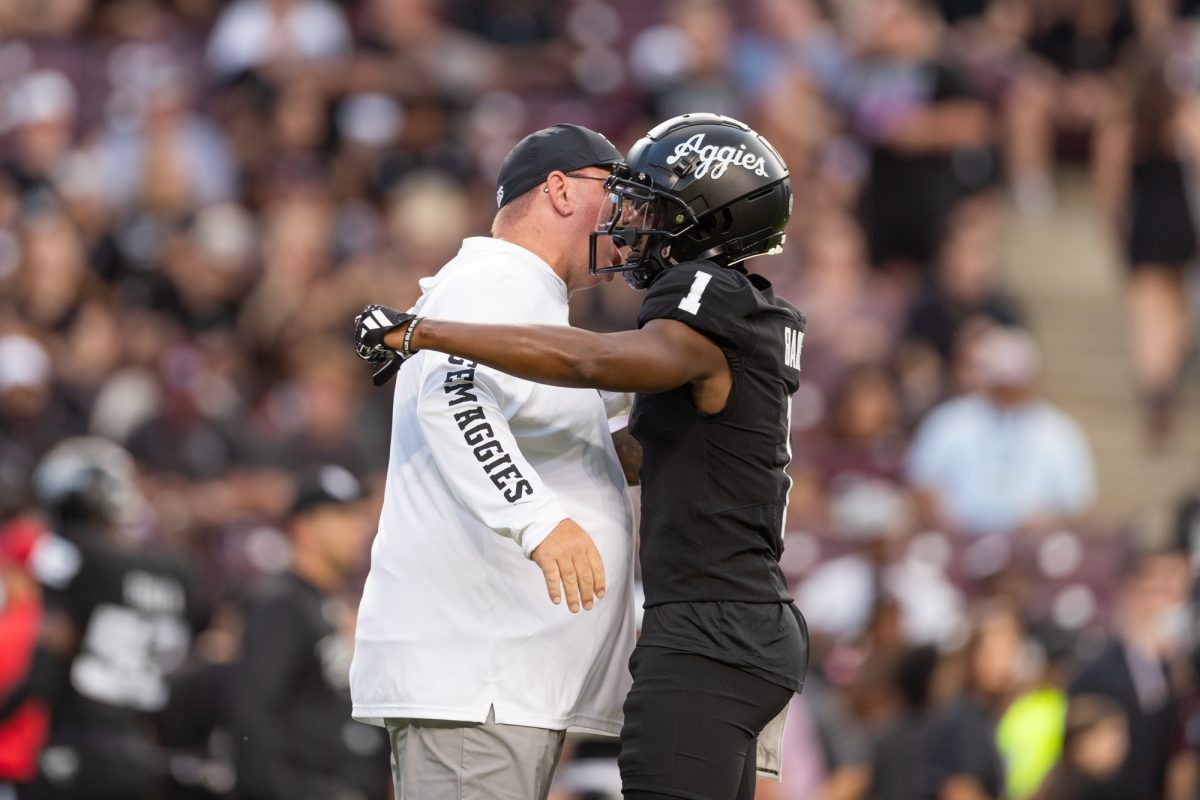 Texas A&M Aggies wide receiver Jabre Barber (1) hugs Head Coach Mike Elko before Texas A&M's game against LSU at Kyle Field on Saturday, Oct. 26, 2024. (Adriano Espinosa/The Battalion)