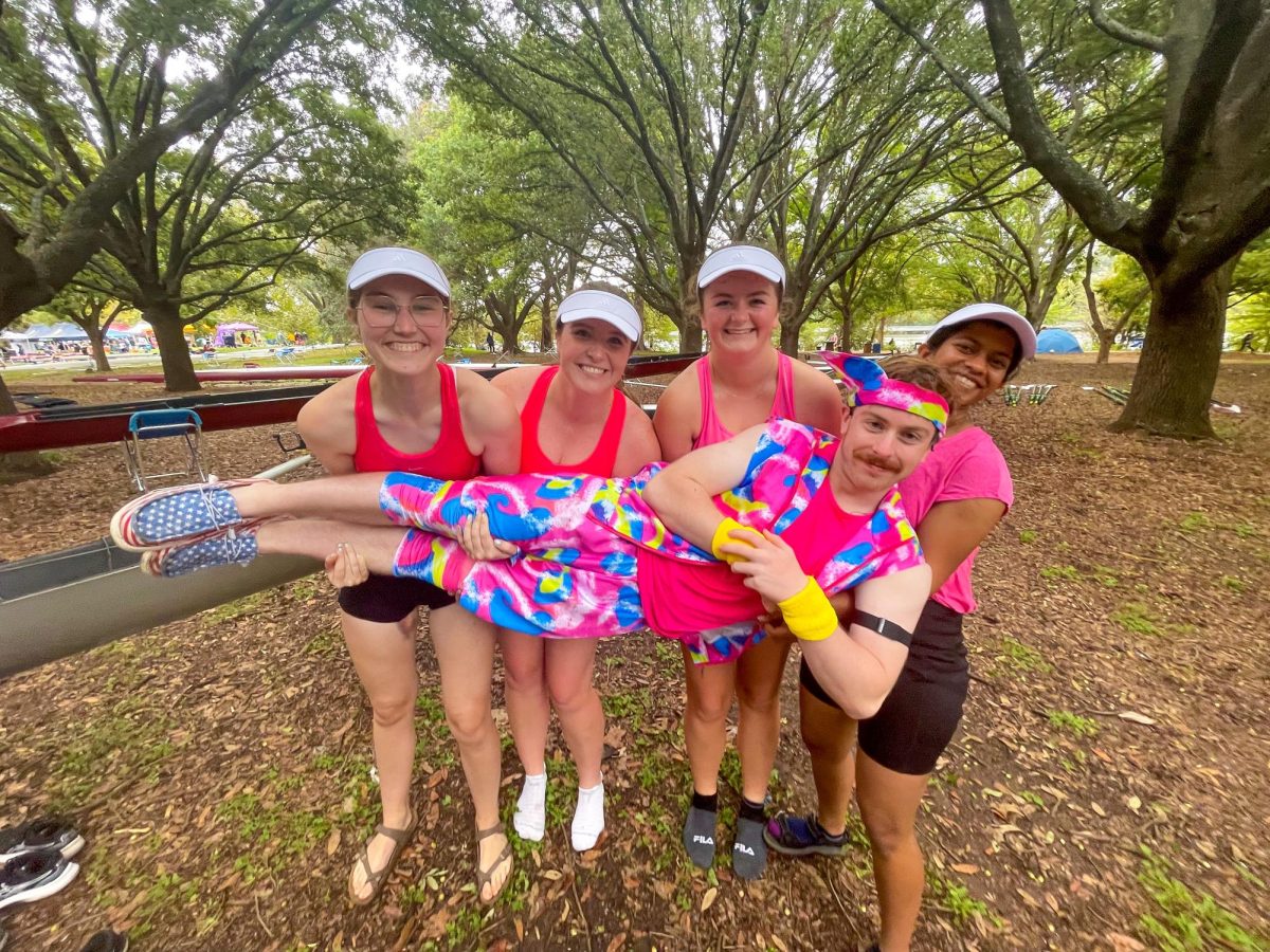 Texas A&M Crew members (left to right) political science junior Abby Dudley, philosophy senior Hope Klingenstein, Blinn Team sophomore Caitriona Lifton, and former team members Lianne D’Souza and (front) Jack Krueger dressed as Barbies for the 2023 Pumpkinhead Regatta. Texas A&M Crew will compete in the 2024 Pumpkinhead Regatta on Oct. 26, 2024 in Waco.