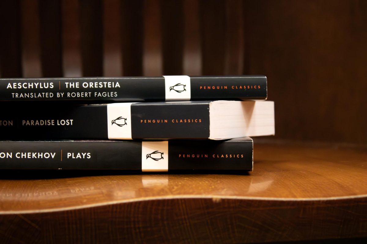 A stack of Penguin Classics books sit on a chair on Monday, Oct. 14, 2024. (Tilly Hillje/ The Battalion)