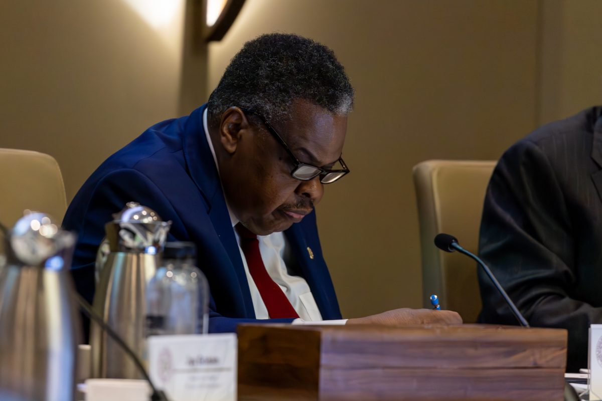 Board of Regents Chairman Bill Mahomes reads a document during the Board of Regents meeting on Thursday, Nov. 7, 2024. (Jackson Stanley/The Battalion)