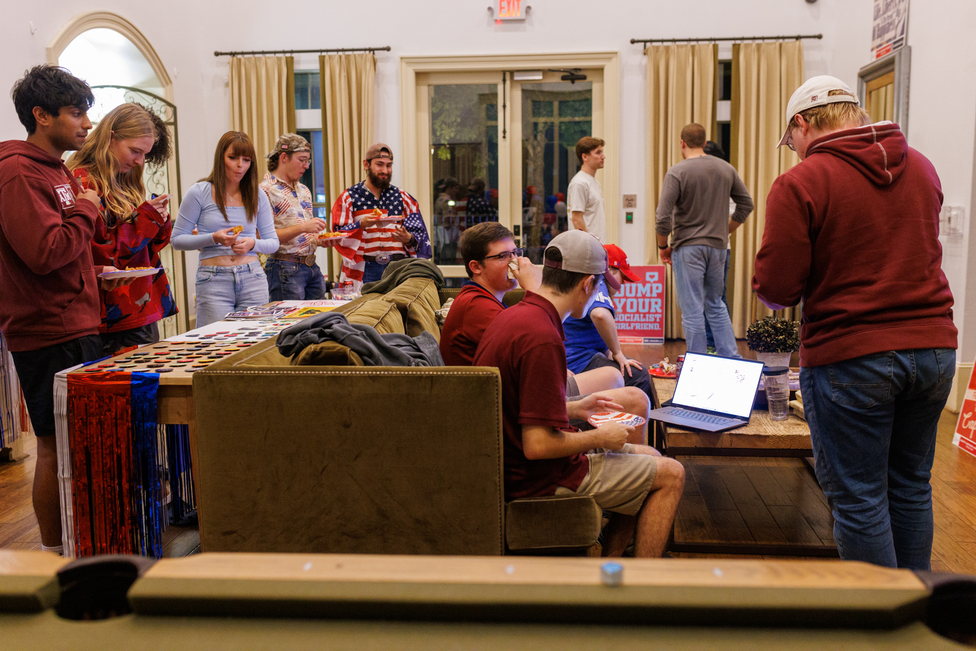 Attendees gather to watch election results at a watch party hosted by Turning Point USA at Lake Walk at Traditions in Bryan.