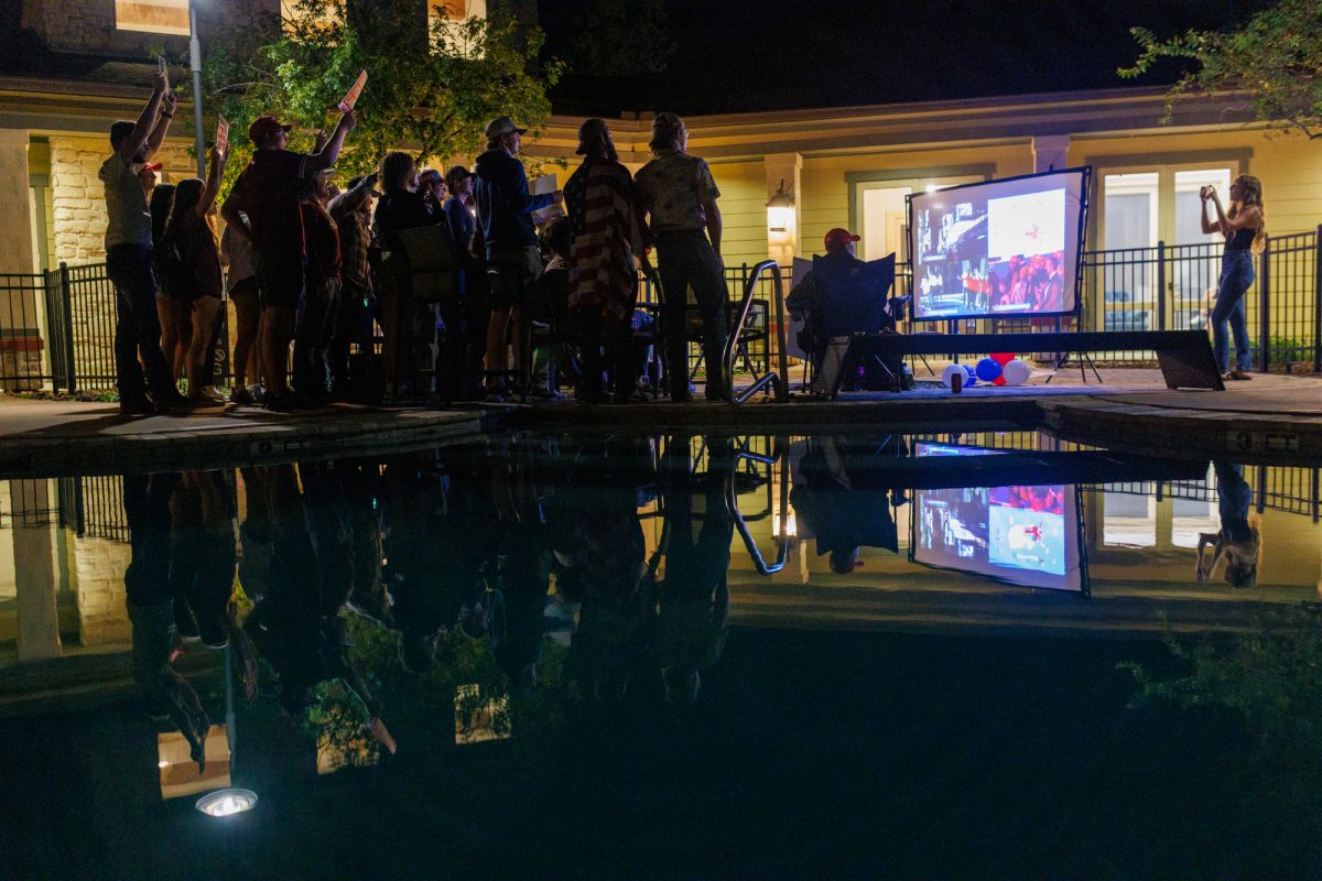 Attendees pose for a photo during the Texas A&amp;M Turning Point USA election night watch party at Lake Walk at Traditions in Bryan, Texas, on Nov. 5, 2024.