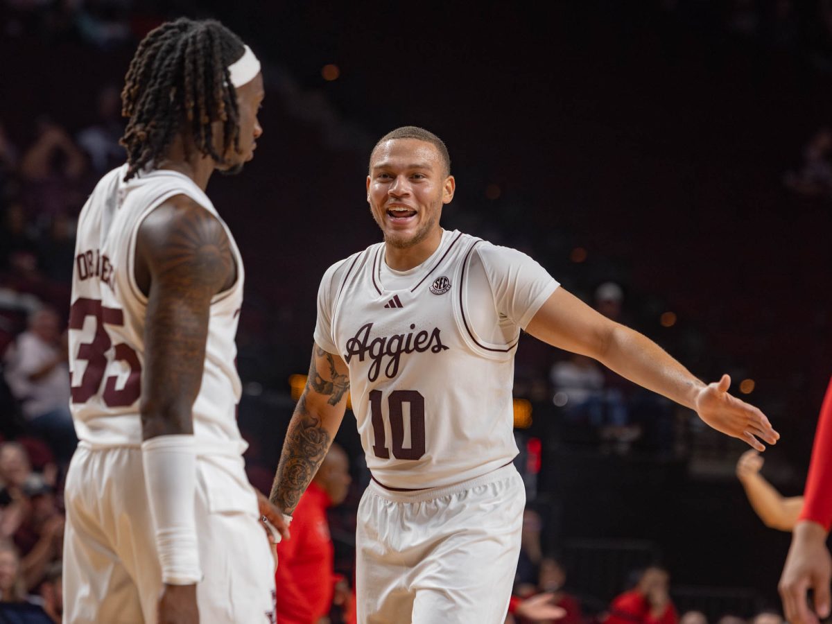 Texas A&M forward CJ Wilcher (10) reacts with guard Manny Obaseki (35) during Texas A&M's game against Lamar at Reed Arena on Monday, Nov 11, 2024. (Micah Richter/The Battalion)