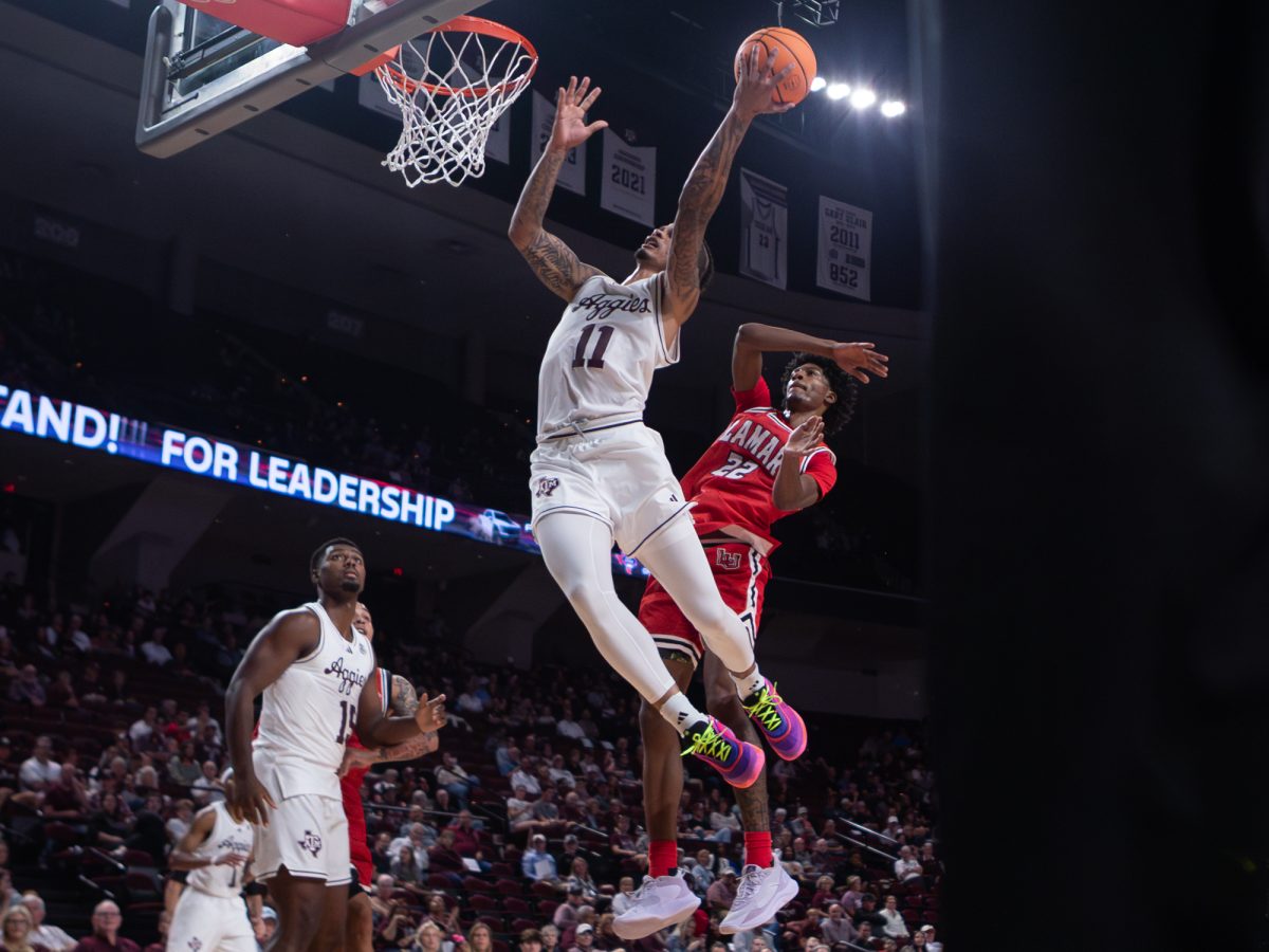 Texas A&amp;M forward Andersson Garcia (11) goes up to to score during Texas A&amp;M’s game against Lamar at Reed Arena on Monday, Nov. 11, 2024. (Hannah Harrison/The Battalion)