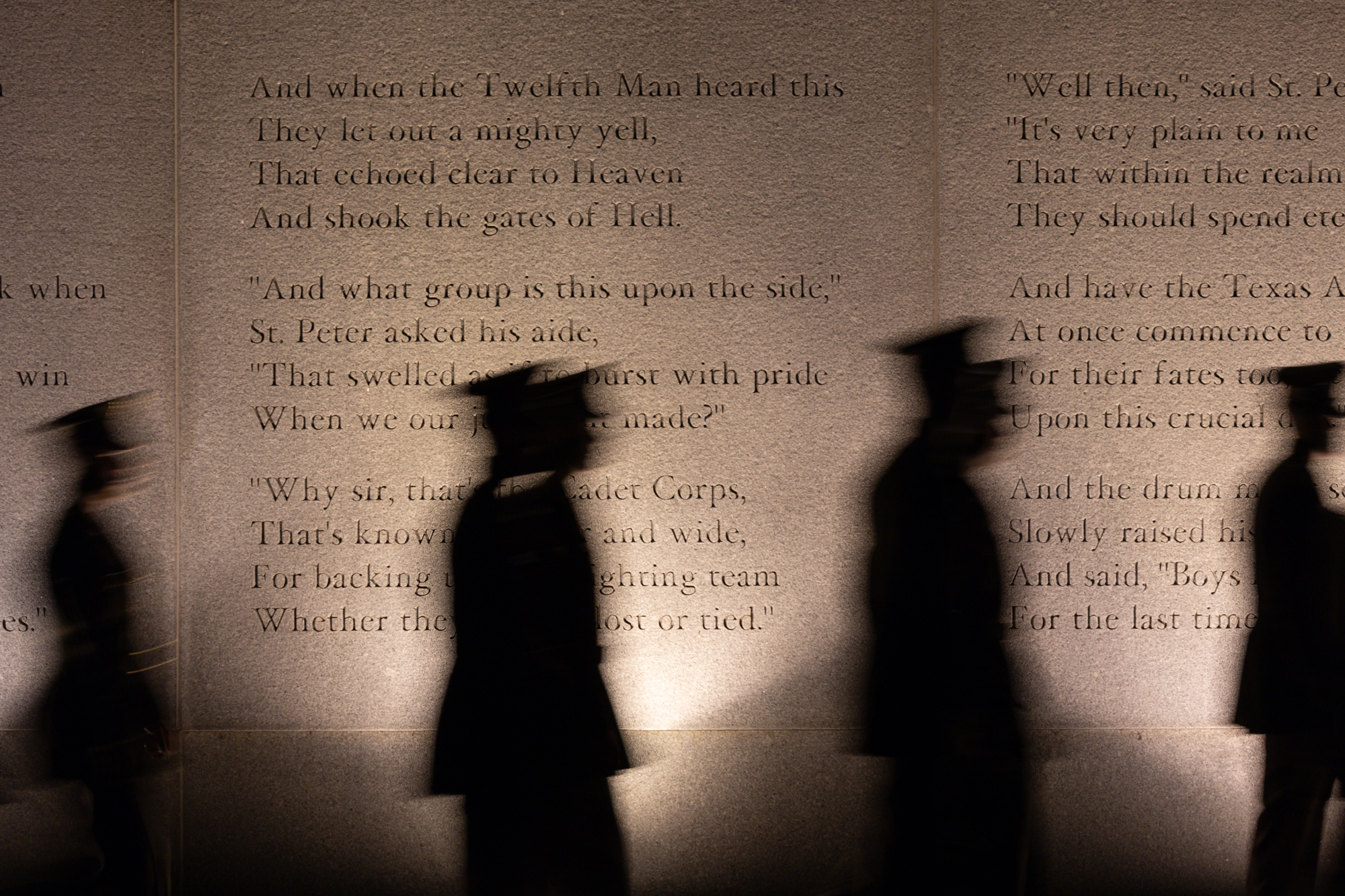 Members of the Corps of Cadets walk past the Last Corps Trips Wall in Memorial Plaza before the Bonfire Remembrance Ceremony at the Bonfire Memorial on Monday, Nov. 18, 2024. 