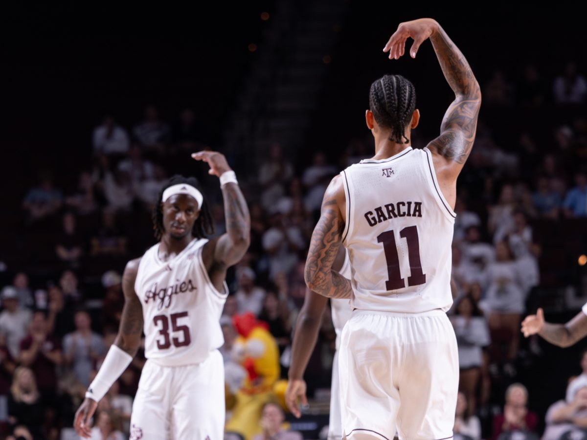 Texas A&amp;M forward Andersson Garcia (11) celebrates a basket with Texas A&amp;M guard Manny Obaseki (35) during Texas A&amp;M’s game against Lamar at Reed Arena on Monday, Nov. 11, 2024. (Hannah Harrison/The Battalion)