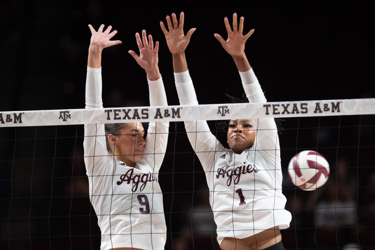 Texas A&M opposite Logan Lednicky (9) and middle blocker Ifenna Cos-Okpalla (1) reach to block the ball during Texas A&M’s game against LSU at Reed Arena on Sunday, Nov. 24, 2024. (Chris Swann/The Battalion)