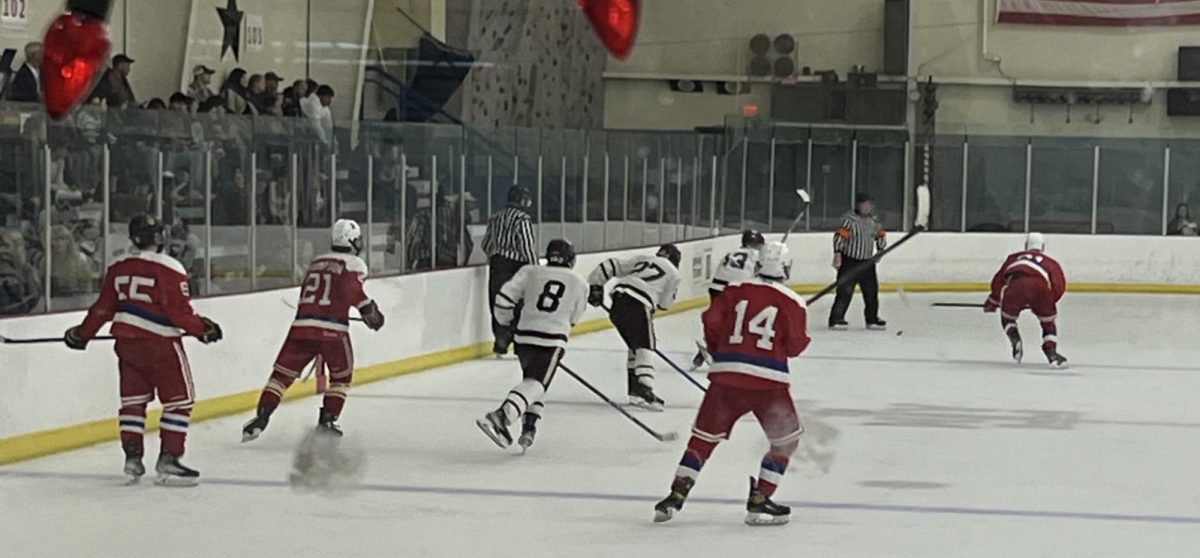 Texas A&M races down the ice working to keep SMU out of the goal after sending two players to the penalty box following a fight between the teams at Spirit Ice Arena on Saturday, Nov. 9, 2024.