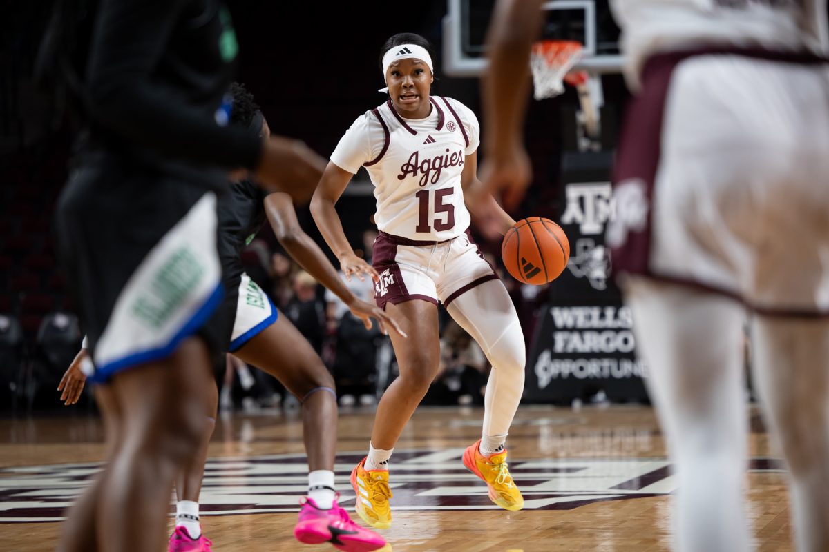 Texas A&amp;M guard Sole Williams (15) looks to pass the ball during Texas A&amp;M’s game against A&amp;M-Corpus Christi at Reed Arena on Monday, Nov. 4, 2024. (Chris Swann/The Battalion)