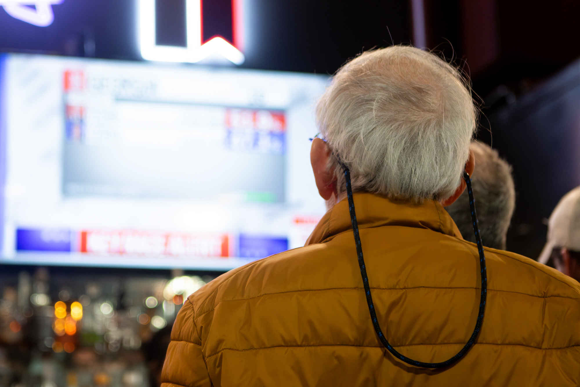 An attendee watches the TV as Trump takes the lead in election polls at a watch party in Billy’s Bar and Grill hosted by Brazos County Dems in downtown Bryan.