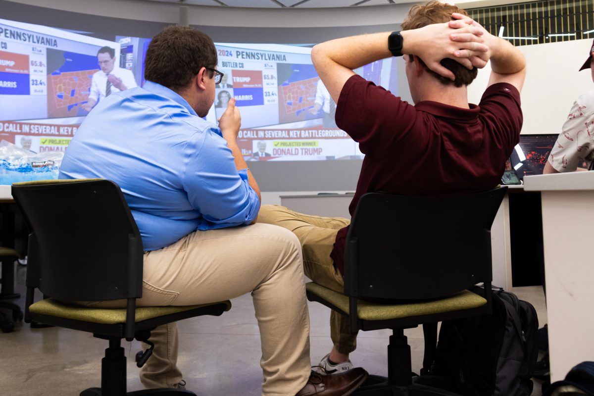 Attendees watch election coverage at a watch party hosted by Members of Aggie Democrats at the ILCB.