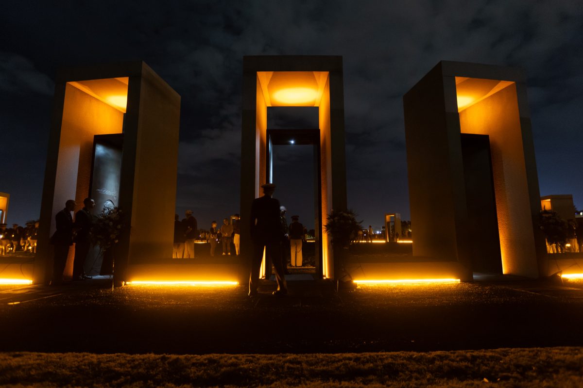 Three of the 12 portals stand illuminated during the Bonfire Remembrance Ceremony at the Bonfire Memorial on Monday, Nov. 18, 2024.