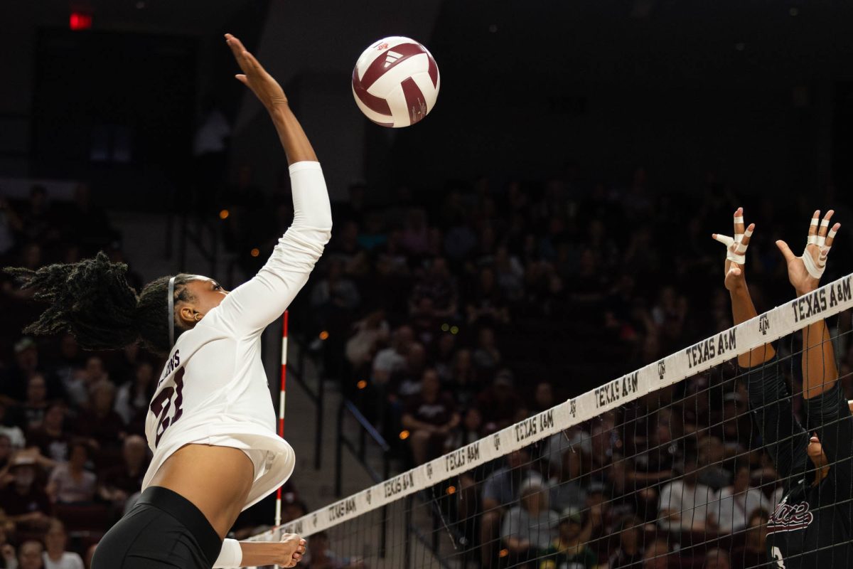 Texas A&amp;M middle blocker Morgan Perkins (21) spike the ball during Texas A&amp;M’s game against Mississippi State in Reed Arena Sunday, Nov. 3, 2024. (Kelii Horvath/The Battalion)