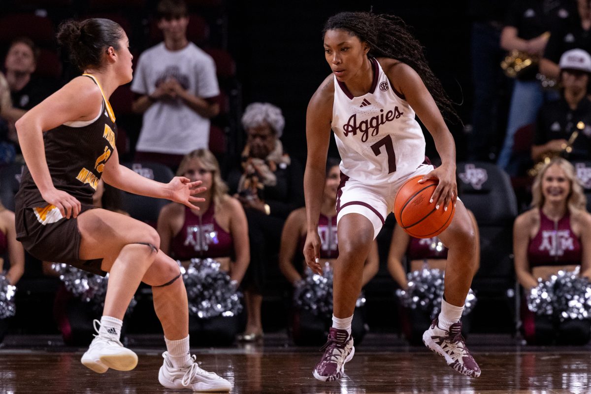 Texas A&M guard Kyndall Hunter (7) dribbles past a defender during Texas A&M's game against Western Michigan at Reed Arena on Sunday, Nov. 10, 2024. (Kelii Horvath/The Battalion)