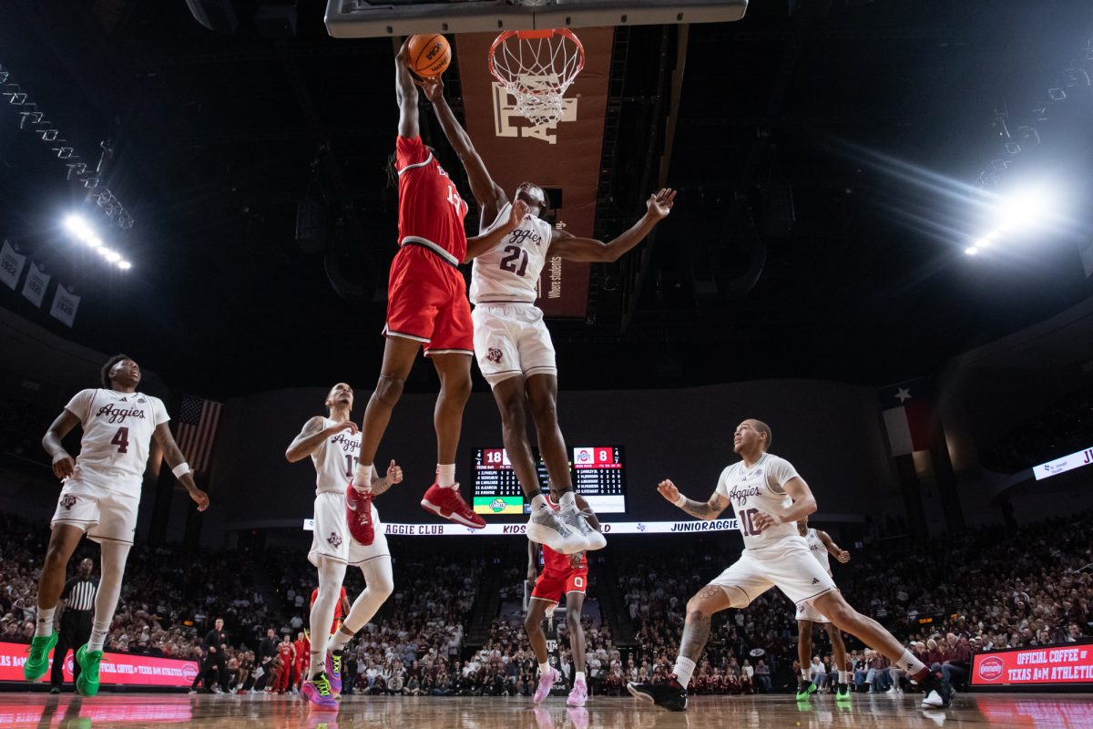 Texas A&M forward Pharrel Payne (21) blocks a shot from Ohio State forward Sean Stewart (13) during Texas A&M’s game against Ohio State at Reed Arena on Friday, Nov. 15, 2024. (Chris Swann/The Battalion)