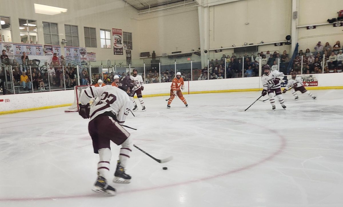 Junior forward Nicholas Leone lines up the shot from the top of the left circle in Texas A&M's 6-3 victory over Texas at Spirit Ice Arena on Friday, Nov. 1, 2024.