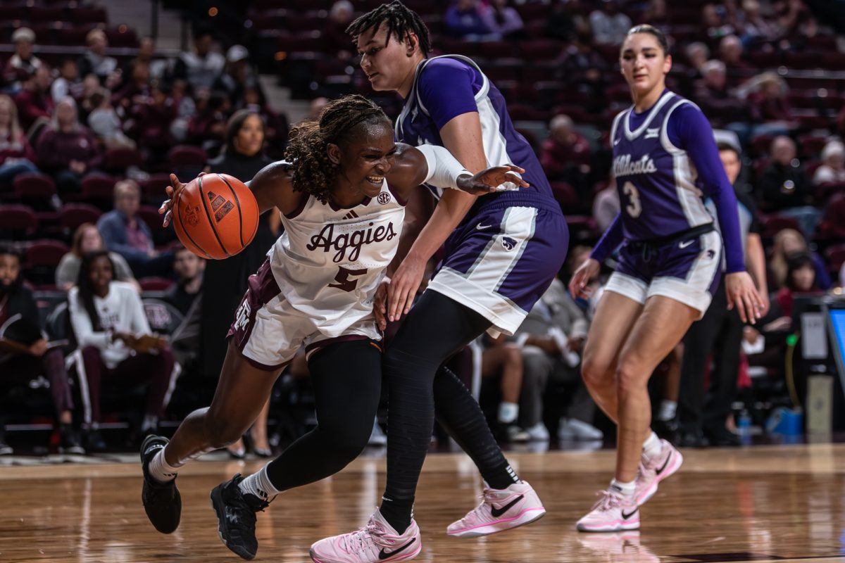 Texas A&amp;M guard Aicha Coulibaly (5) dribbles the ball past an opponent during Texas A&amp;M’s game against Kansas State at Reed Arena on Sunday, Dec. 8, 2024. (Jackson Stanley/The Battalion)