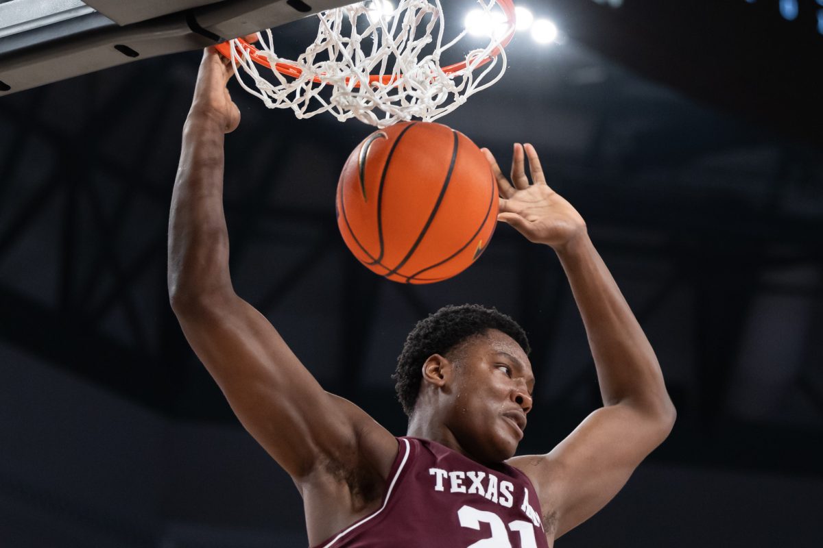 Texas A&amp;M forward Pharrel Payne (21) dunks the ball during Texas A&amp;M’s game against Texas Tech at Dickies Arena in Fort Worth, Texas on Sunday, Dec. 8, 2024. (Chris Swann/The Battalion)