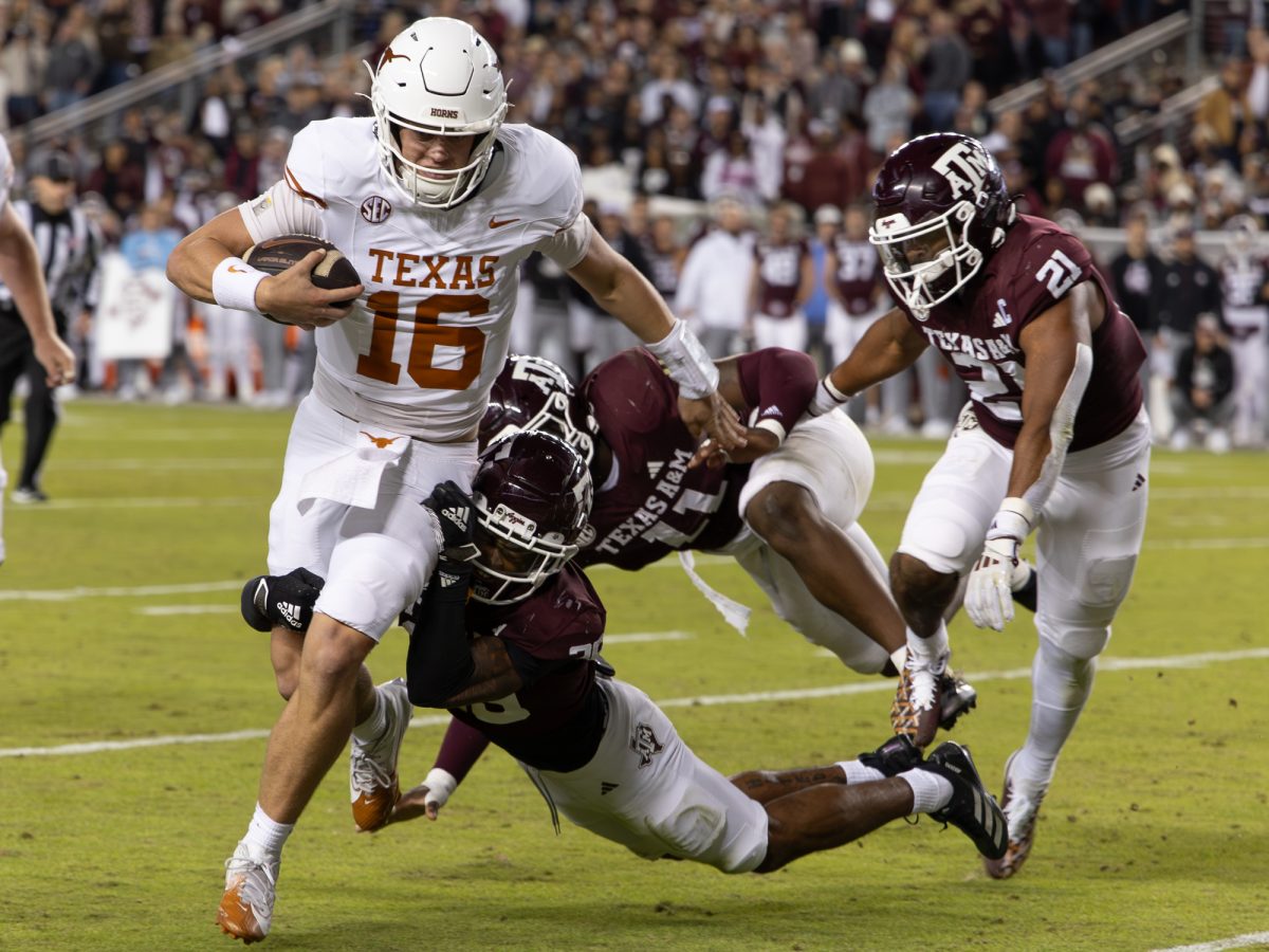 Texas quarterback Arch Manning (16) runs the ball during Texas A&amp;M’s game against Texas at Kyle Field on Saturday, Nov. 30, 2024. The return of the Lone Star Showdown resulted in a 17-7 Aggie loss, closing the window for The Maroon and White’s SEC championship game and College Football Playoff hopes. 