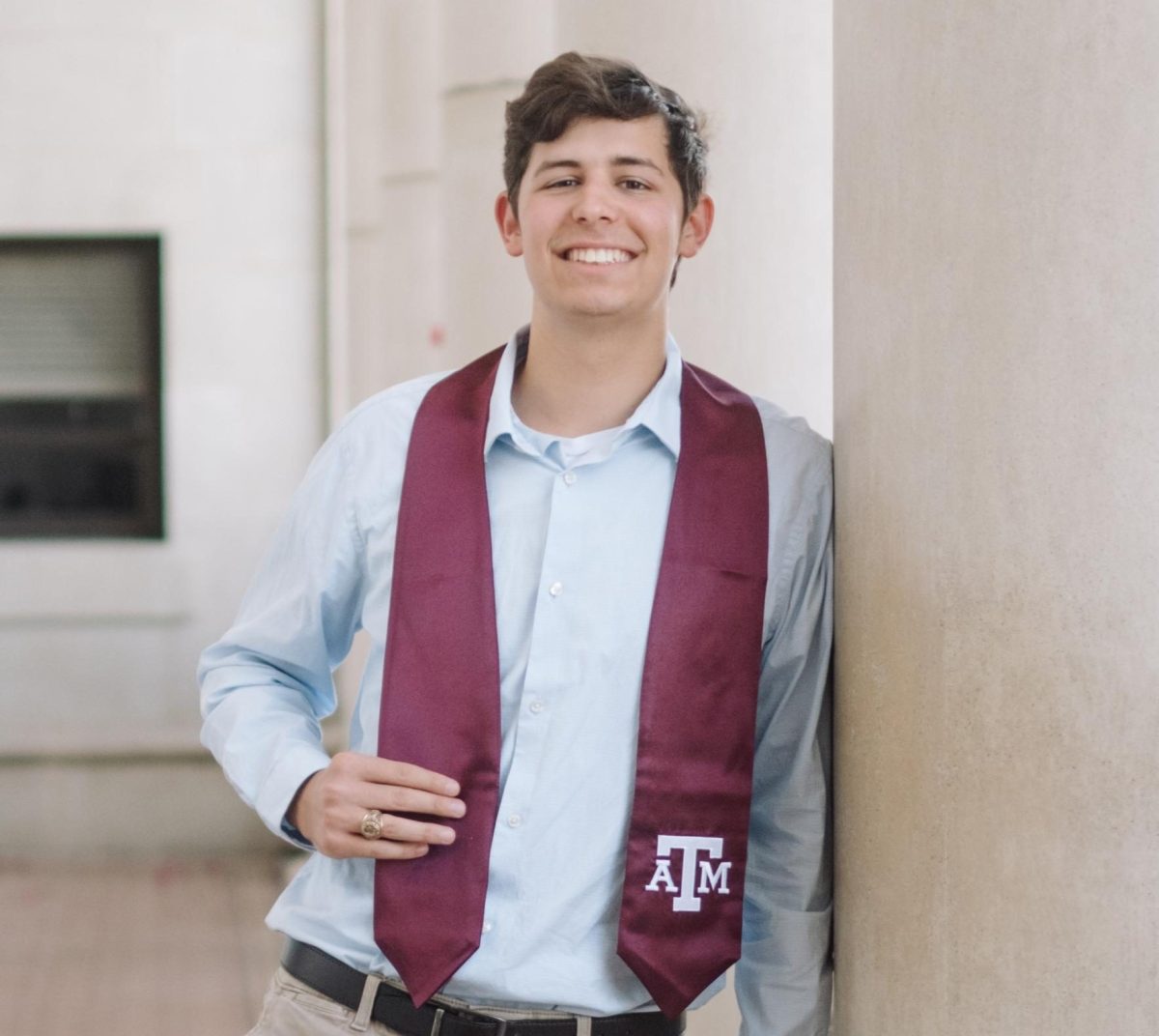 Sports editor Luke White poses in front of the Administrative Building.