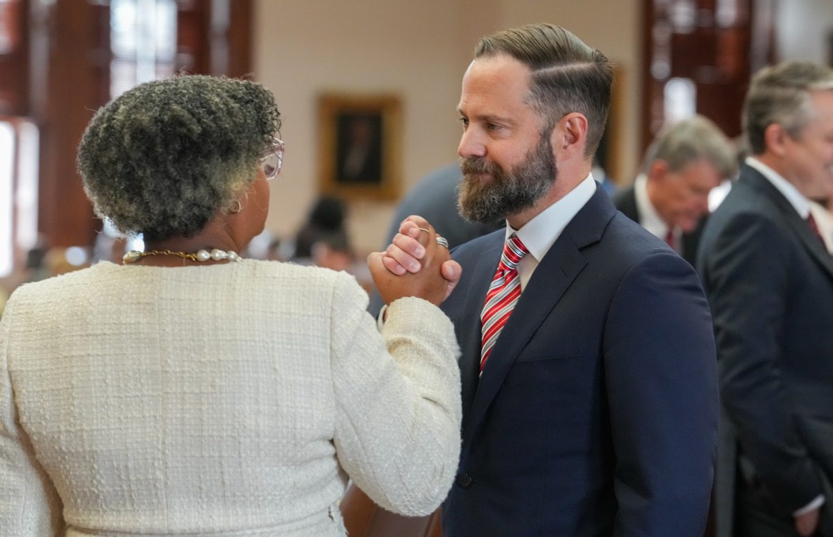 State Rep. Dustin Burrows, R-Lubbock, shakes hands with Rep. Rhetta Bowers after he was elected House speaker on the second vote of the members on the opening day of the 89th legislative session at the Capitol in Austin on Jan. 14, 2025. (Photo by Bob Daemmrich for the Texas Tribune)