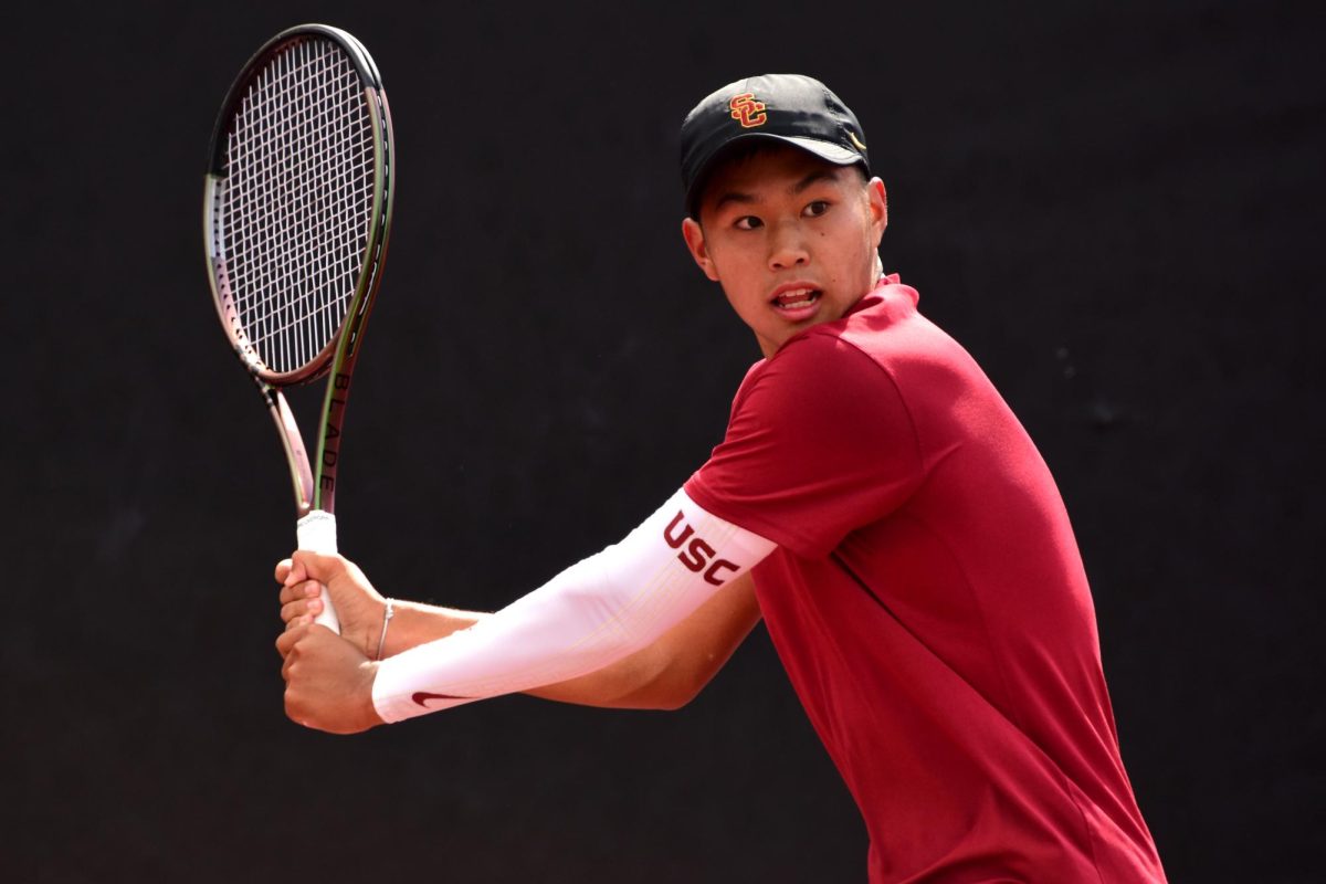 Learner Tien swings the tennis racket in a match against Oregon. FILE