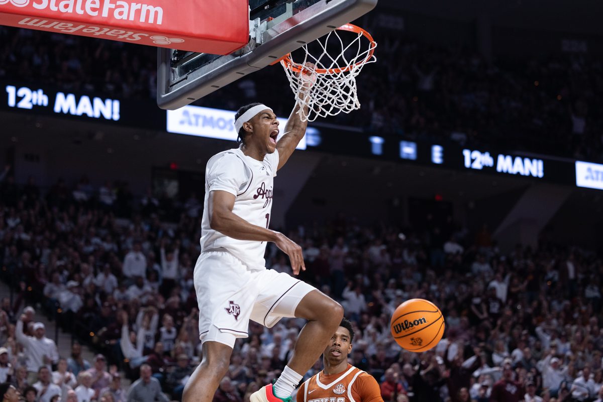 Texas A&M guard Zhuric Phelps (1) dunks the ball after making a steal during Texas A&M’s game against Texas at Reed Arena on Saturday, Jan. 4, 2025. (Chris Swann/The Battalion)