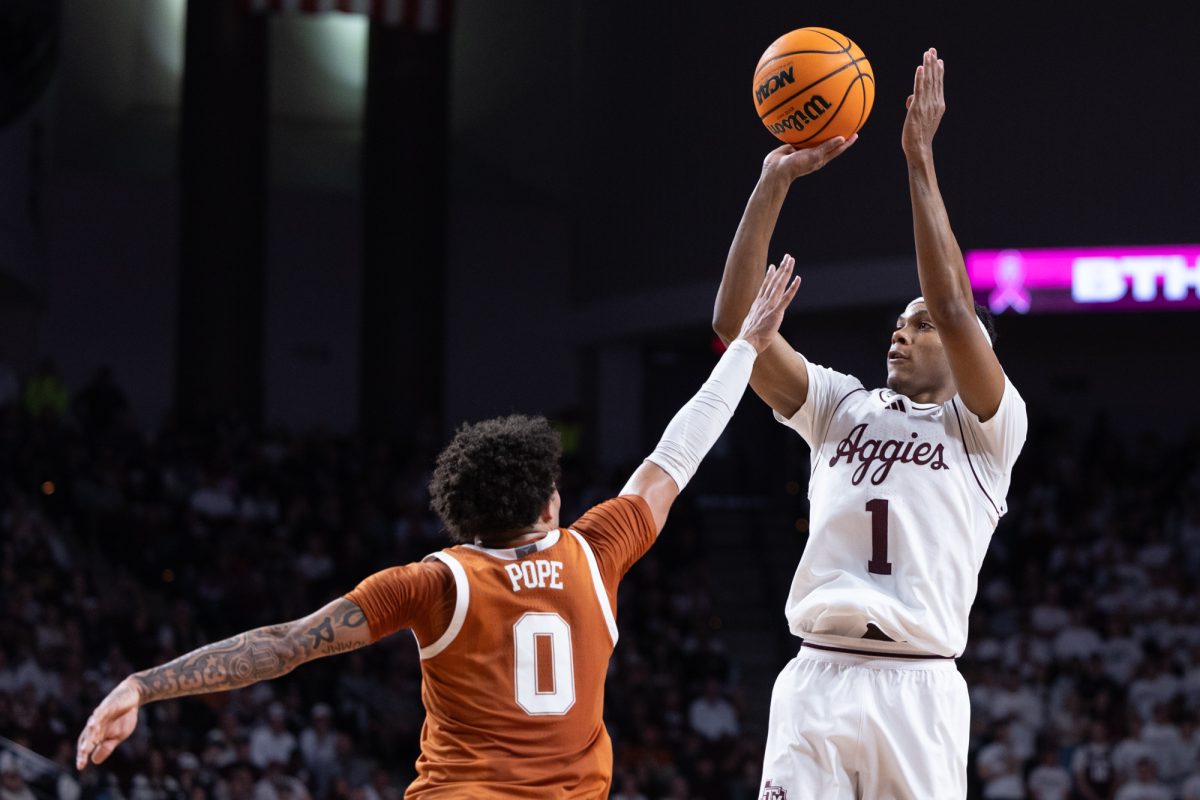 Texas A&M guard Zhuric Phelps (1) shoots the ball during Texas A&M’s game against Texas at Reed Arena on Saturday, Jan. 4, 2025. (Chris Swann/The Battalion)