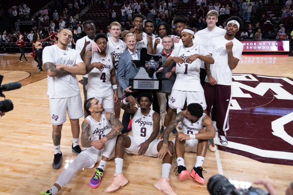 The Aggies pose with the Lone Star showdown Trophy after Texas A&amp;M’s win against Texas at Reed Arena on Saturday, Jan. 4, 2025. (Chris Swann/The Battalion)