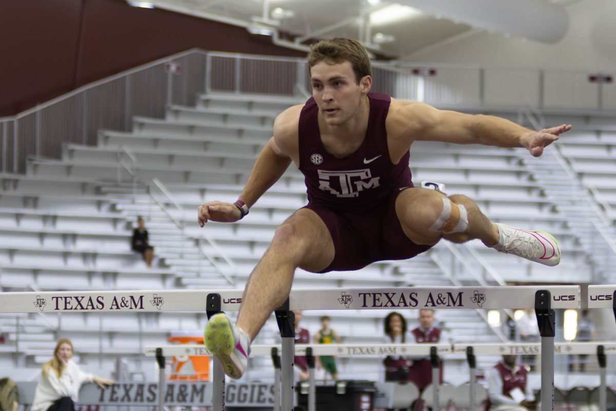 Junior Blake Harris leaps a hurdle during the men’s heptathlon 60m hurdles on day two of the Charlie Thomas Invitational at the Murray Fasken Indoor Track on Saturday, Feb. 8, 2025. (Trinity Hindman/The Battalion)