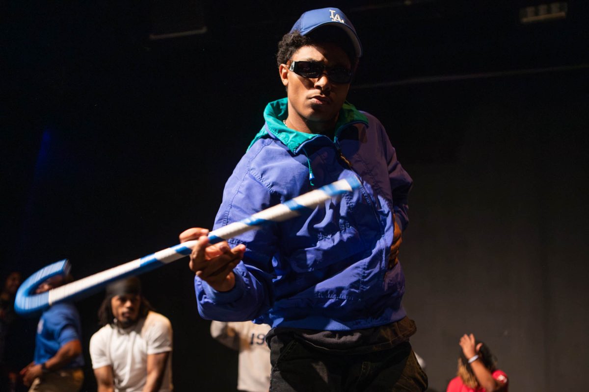 Jacob Gasaway, member of the Delta Theta chapter of Phi Beta Sigma fraternity inc. of Prairie View A&M University, twirls his cane during the BHM Step Show in Rudder Form on Friday, Feb. 28, 2025. (Ashely Bautista/The Battalion)