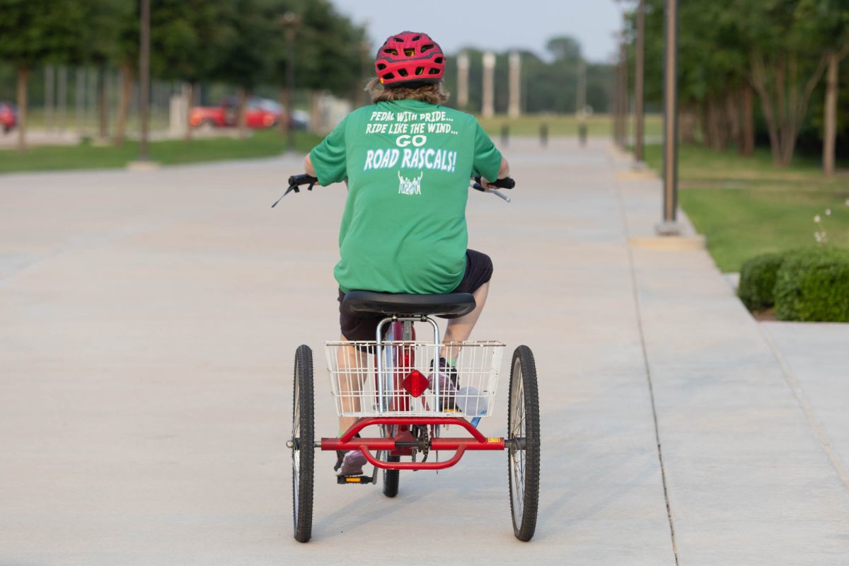 A member of the Road Rascals rides her bike at RELLIS on Saturday, April 26, 2025. (Rocio Salgado/The Battalion)