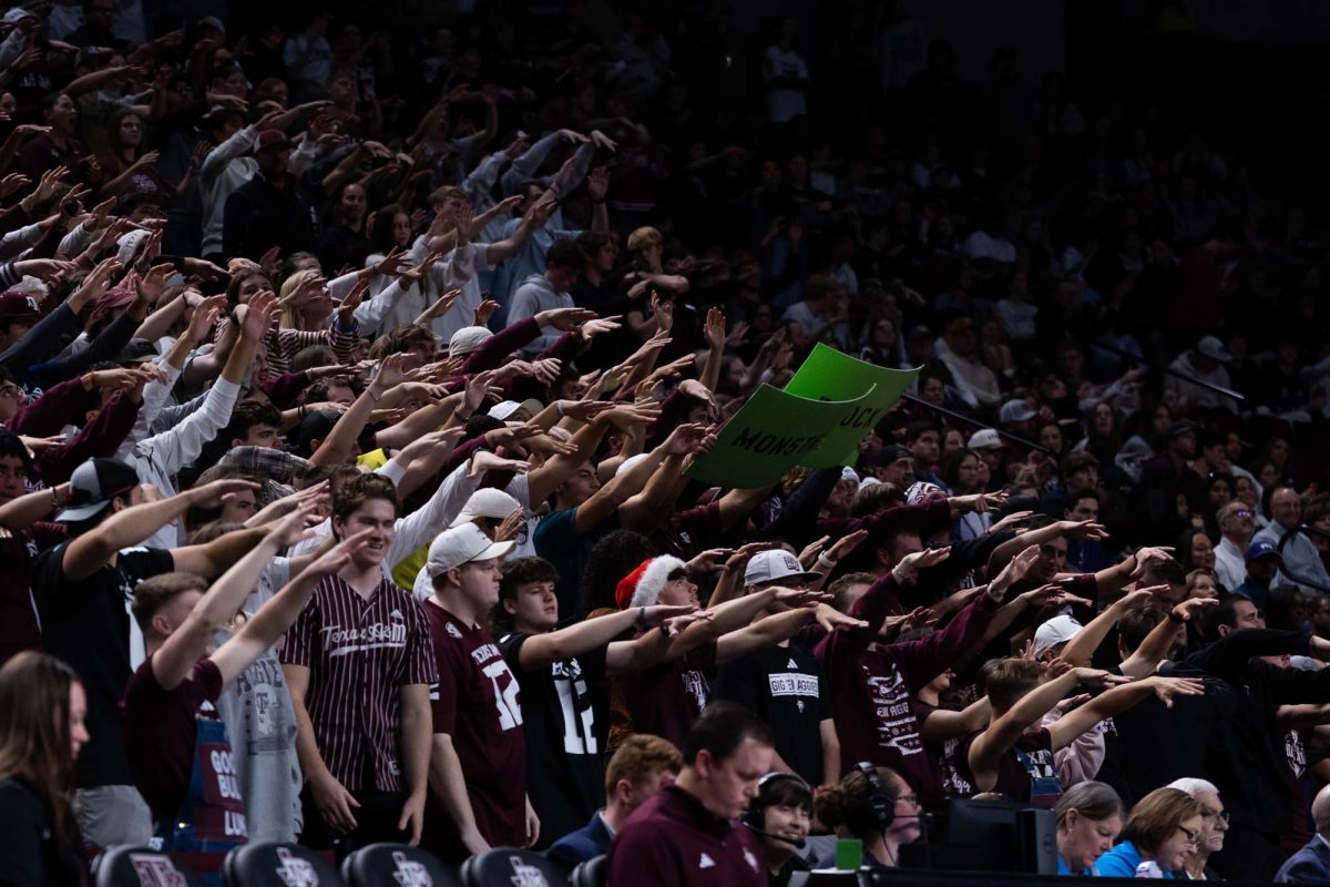 People in the Texas A&M student section react to a block during Texas A&amp;M’s volleyball game against TCU at Reed Arena on Saturday, Dec. 6, 2025. (Rocio Salgado/The Battalion)